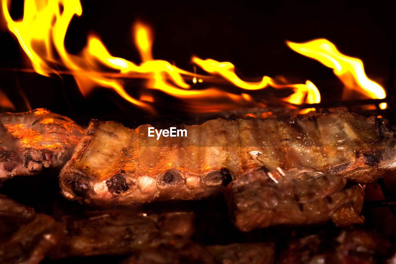 CLOSE-UP OF BONFIRE ON BARBECUE