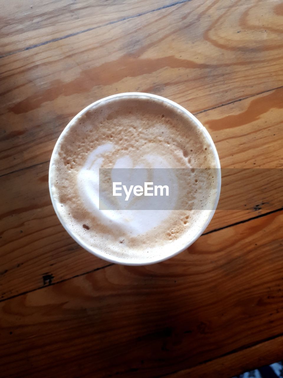 High angle view of cappuccino on table