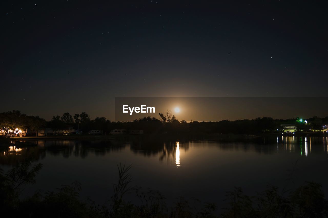 SCENIC VIEW OF LAKE AT NIGHT