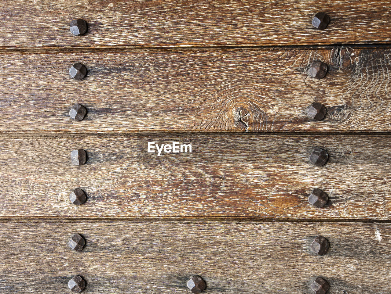 Old boards and metal rivets. backgrounds and textures