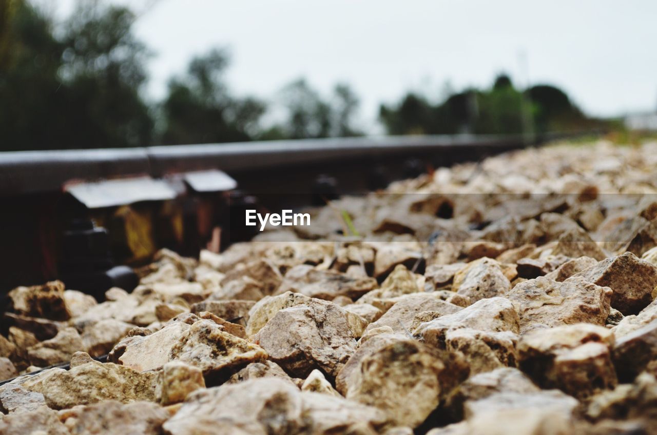 Close-up of rocks by railroad track