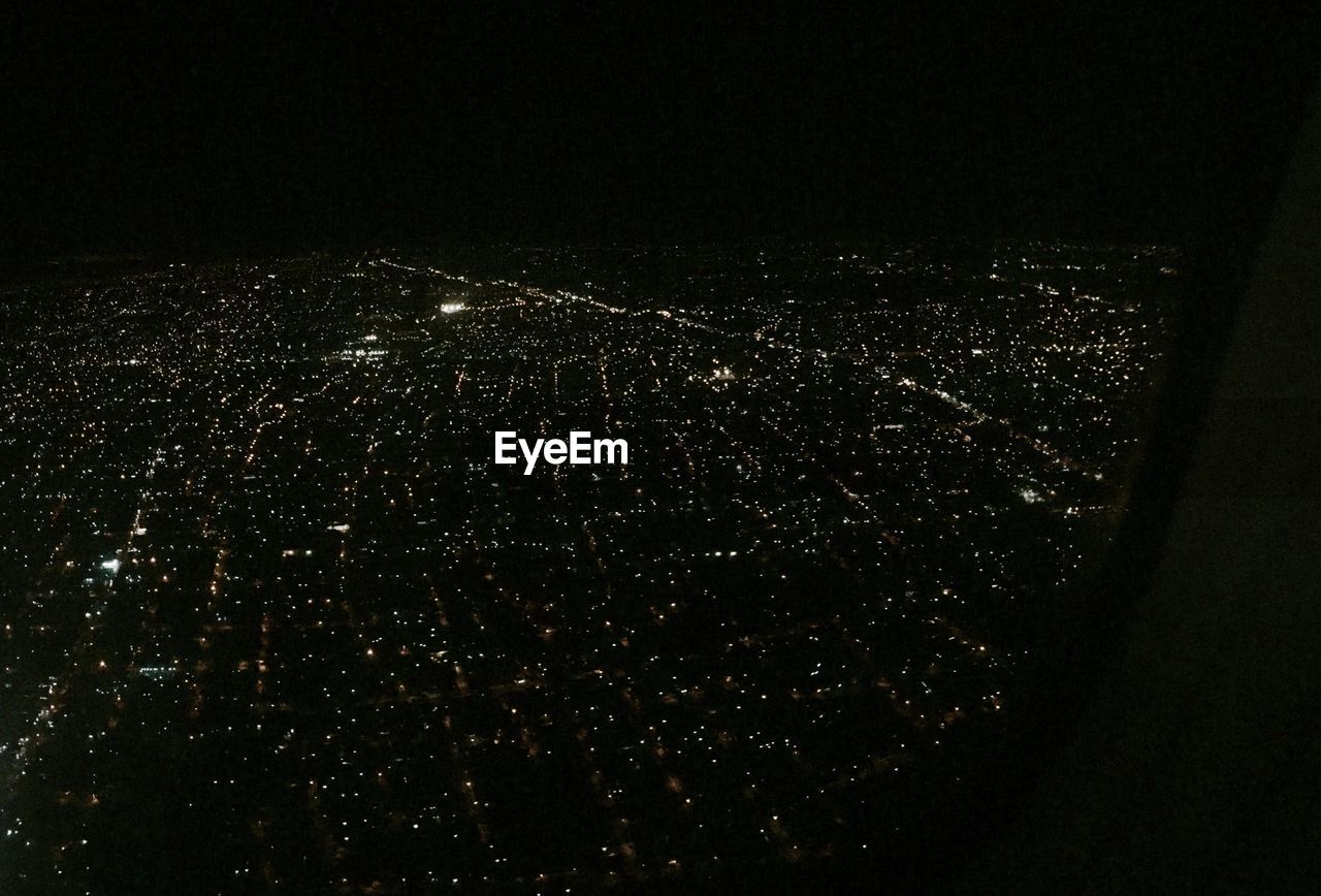 CLOSE-UP OF ILLUMINATED CITYSCAPE AT NIGHT