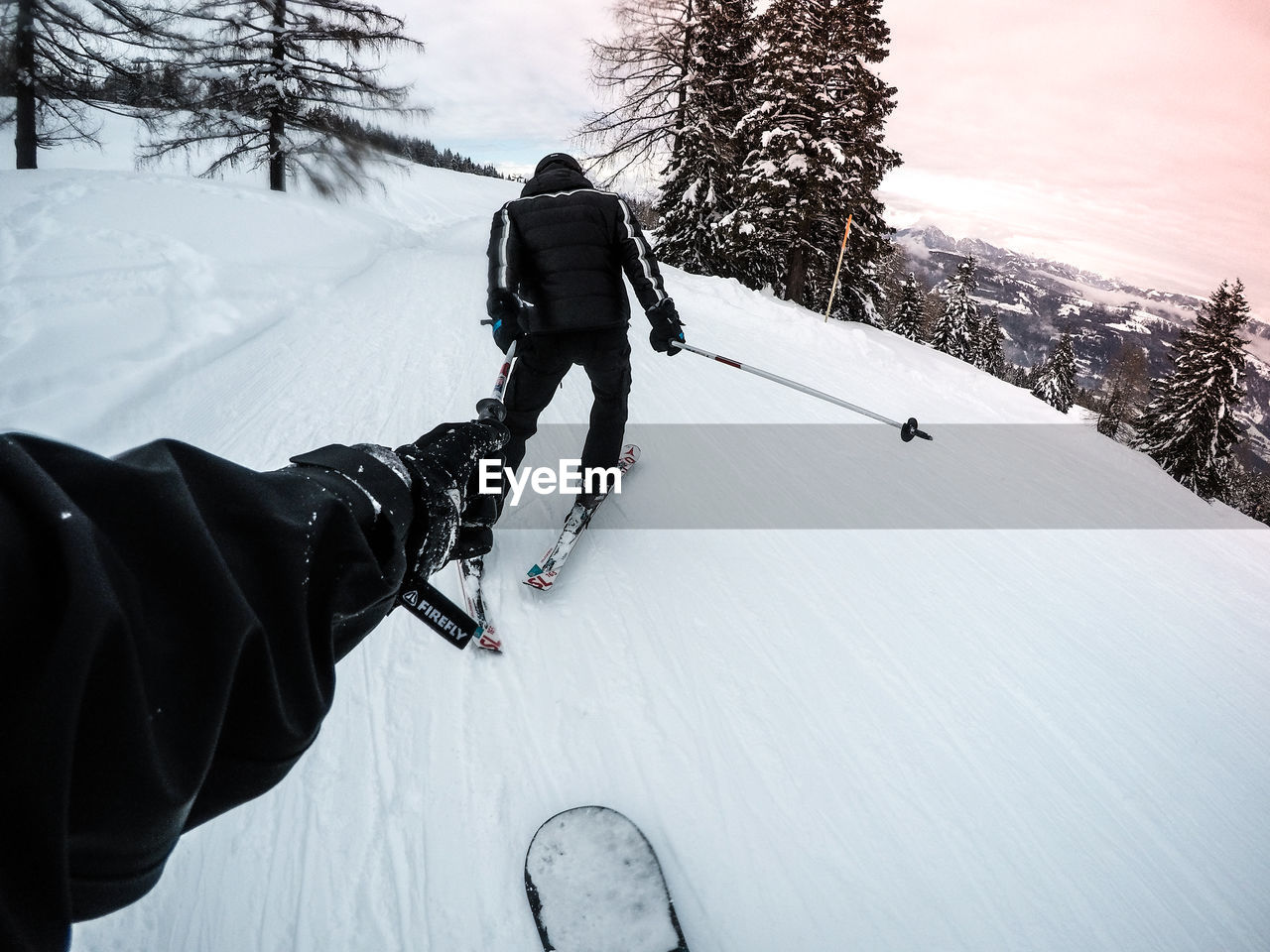 PEOPLE WALKING ON SNOW COVERED LAND