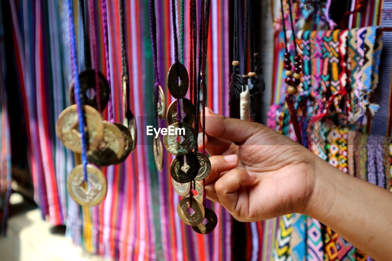 Close-up of hand holding decoration at store