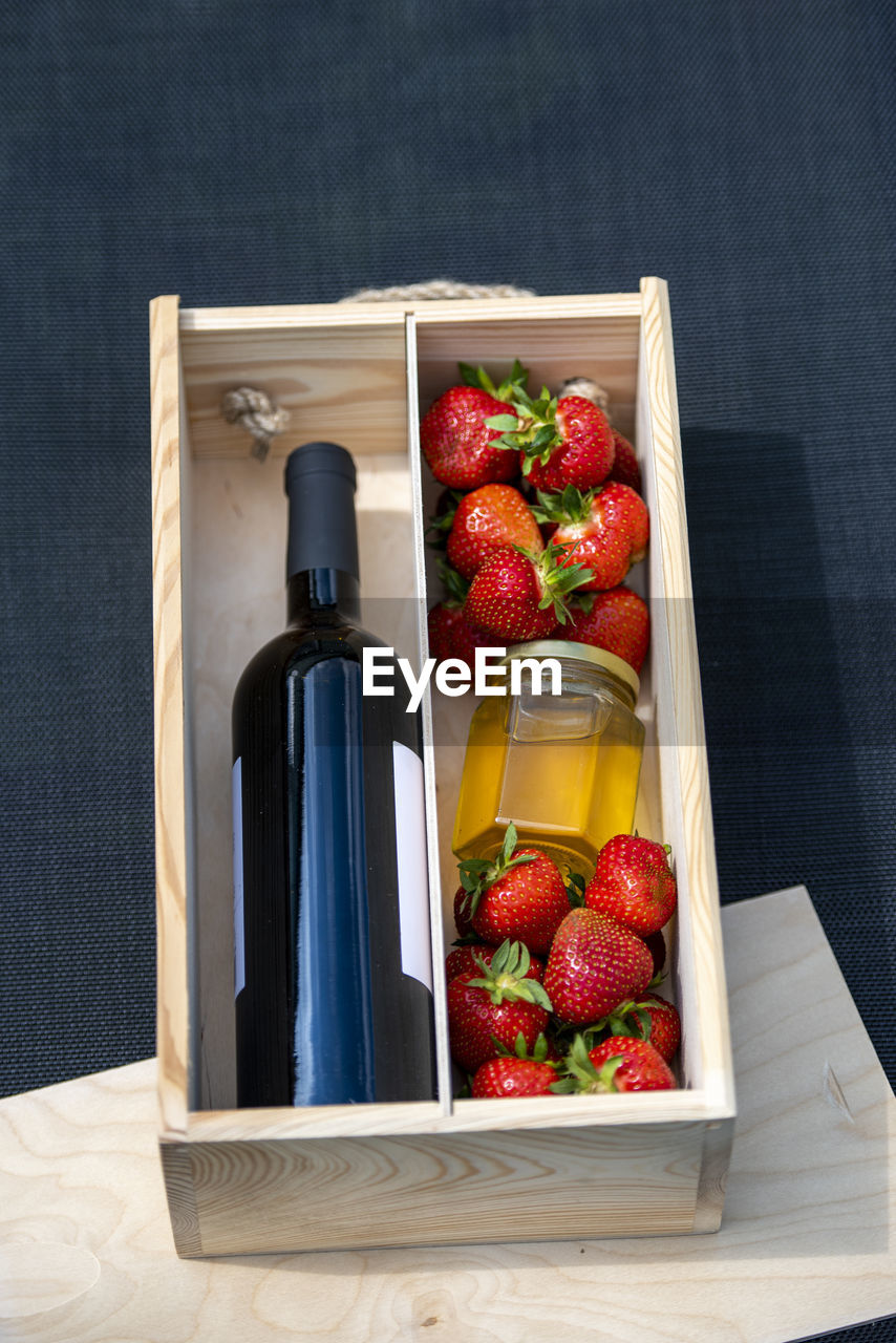 food and drink, food, healthy eating, container, freshness, berry, fruit, strawberry, studio shot, wellbeing, red, indoors, no people, box, wood, still life, vegetable, bottle, variation, painting, household equipment, produce, organic, crate, drink