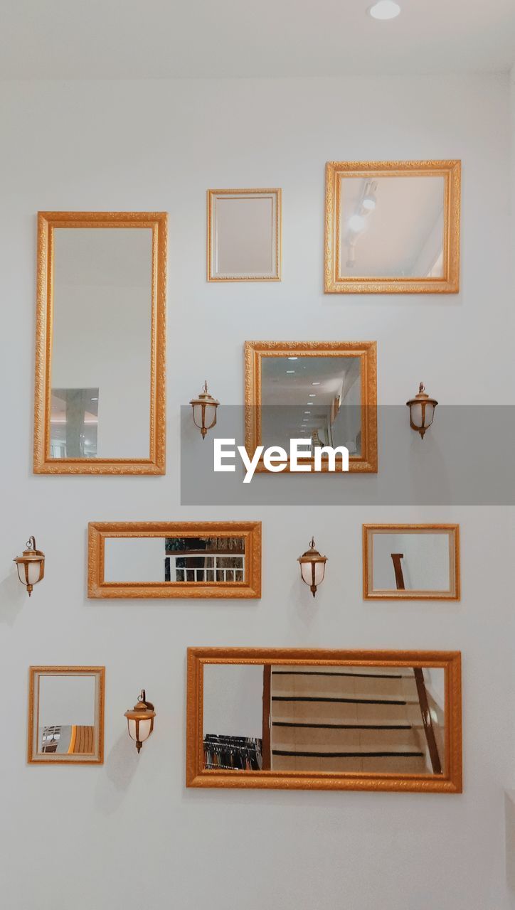 Low angle view of mirrors on wall at home