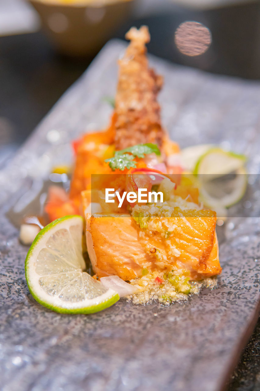 CLOSE-UP OF FISH ON TABLE