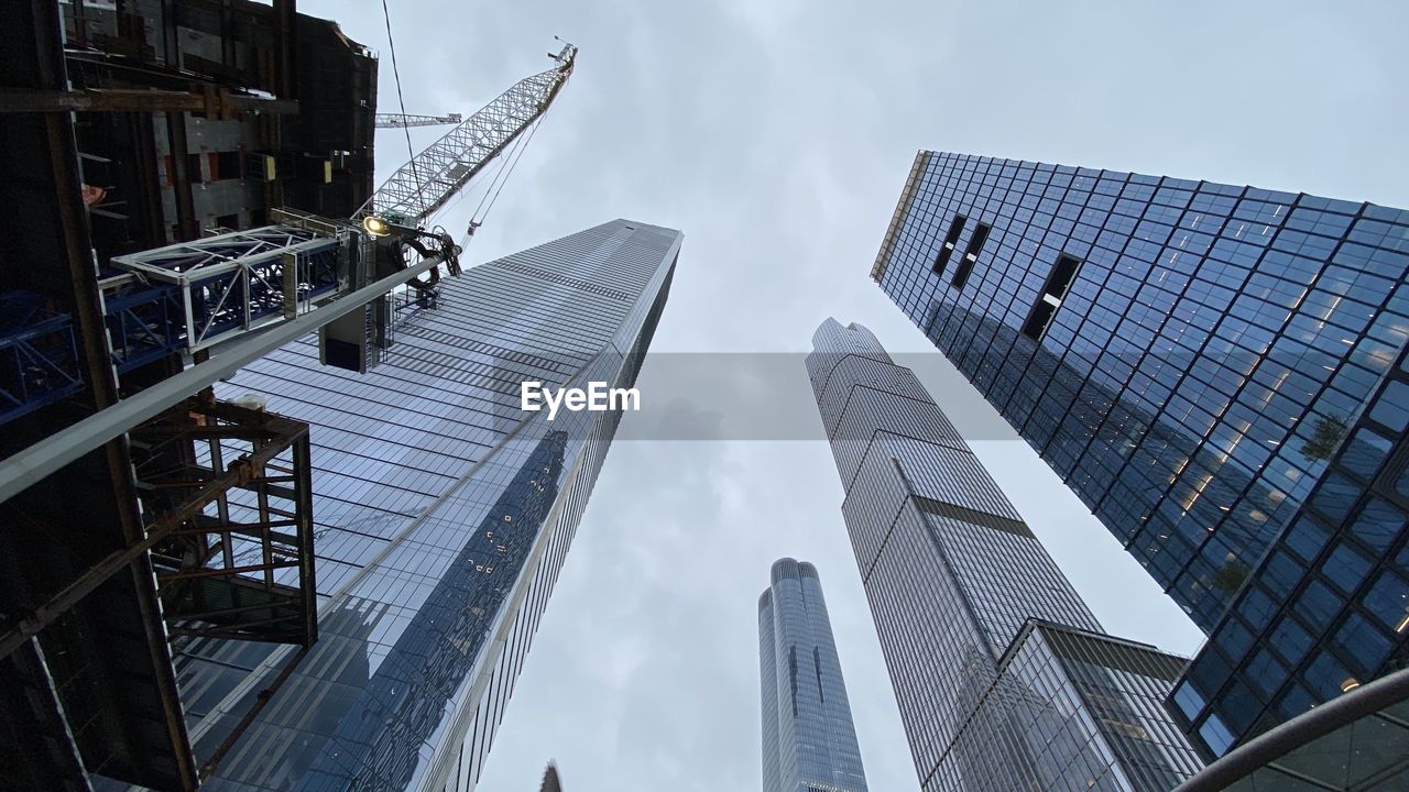 Low angle view of modern buildings against sky