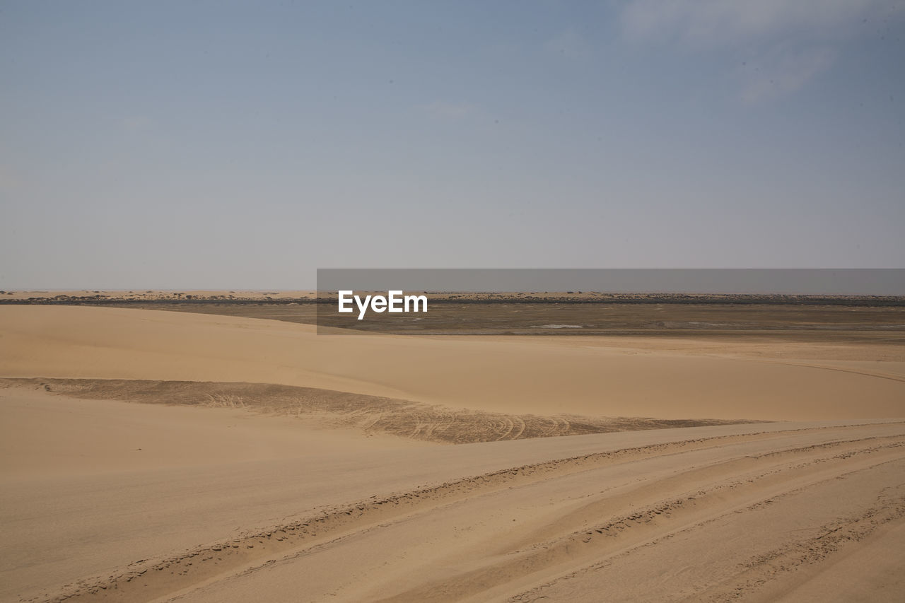 Scenic view of landscape at namib desert against sky