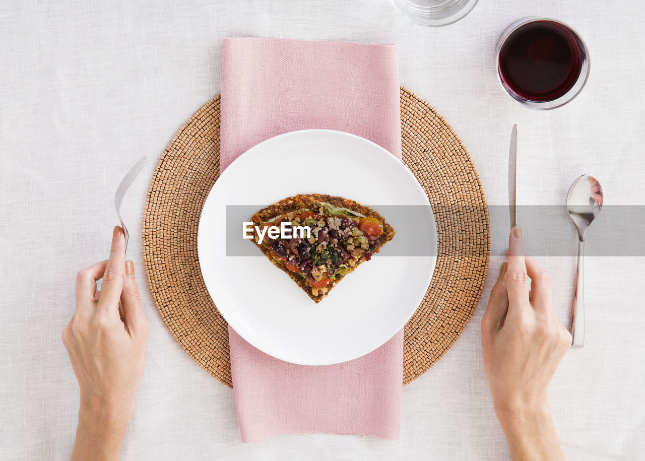 Overhead view of woman having food at table