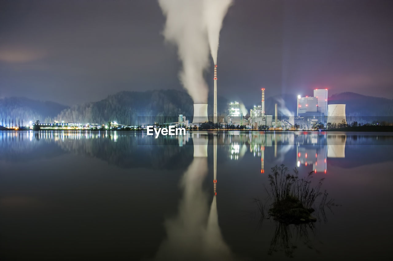 SMOKE EMITTING FROM FACTORY AT NIGHT