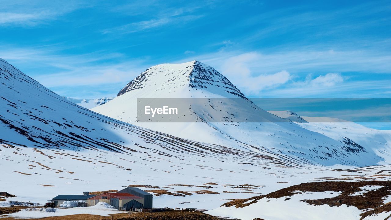 Scenic view of snowcapped mountains against sky