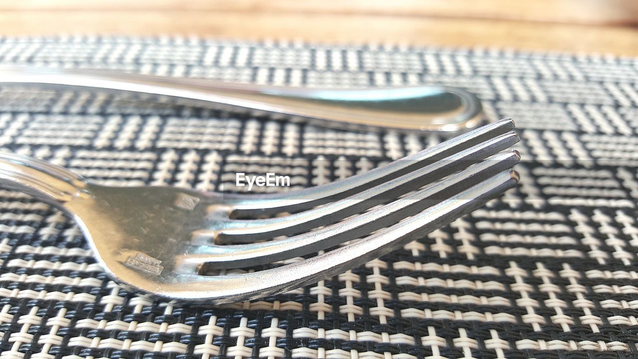 Close up of fork on placemat