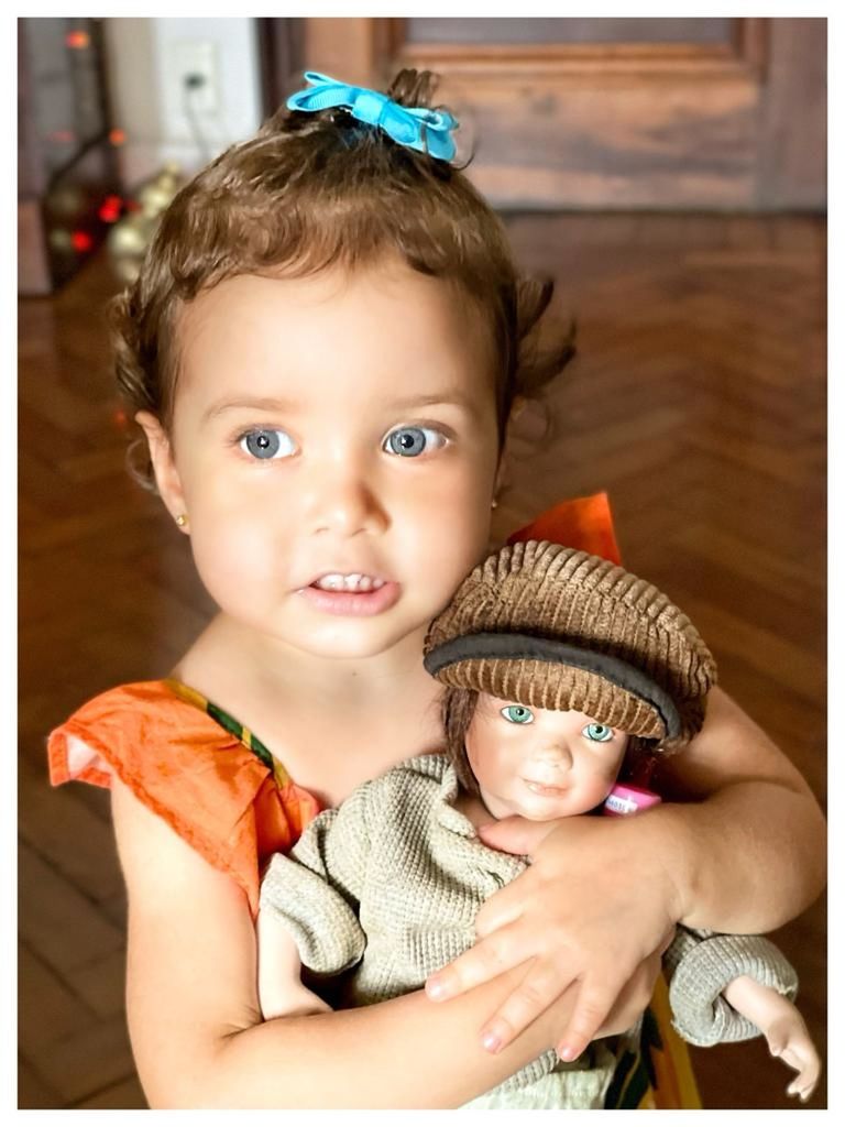 child, childhood, portrait, baby, toddler, looking at camera, cute, emotion, person, smiling, innocence, two people, fashion accessory, human face, indoors, happiness, female, clothing, family, men, women, skin, front view, togetherness, headshot, positive emotion, fun, human head, transfer print, lifestyles, toy, hat