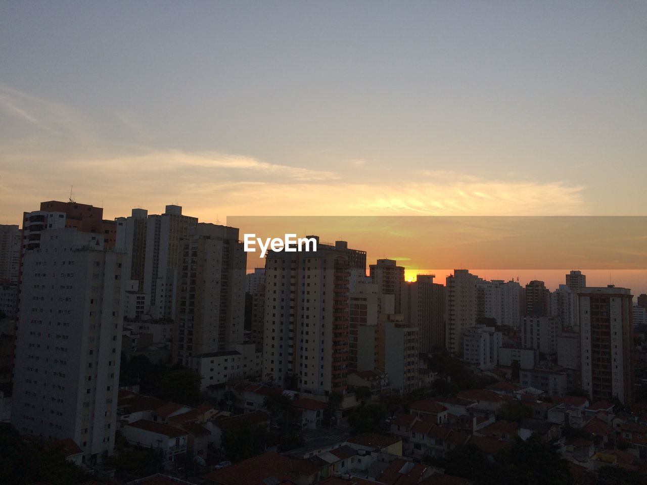 BUILDINGS AGAINST SKY DURING SUNSET