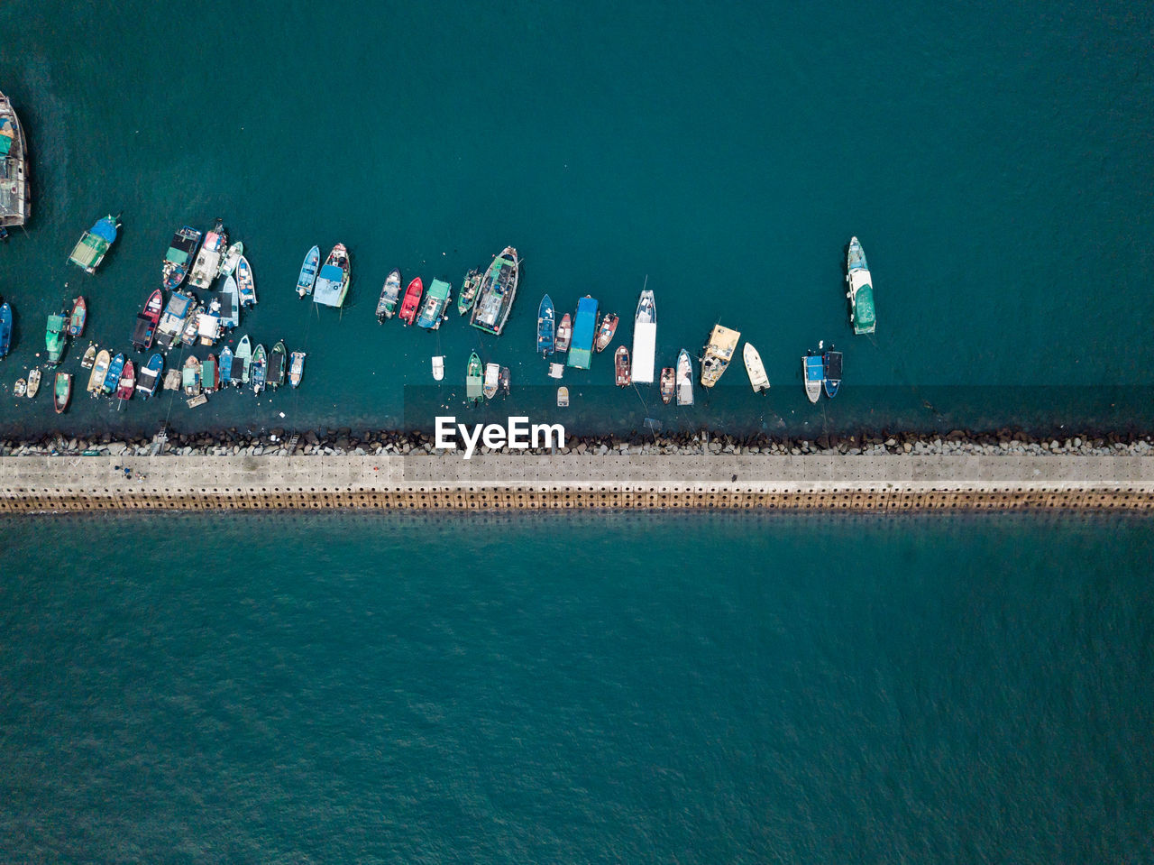 Small fishing boats near the wave barrier in aberdeen bay hong kong