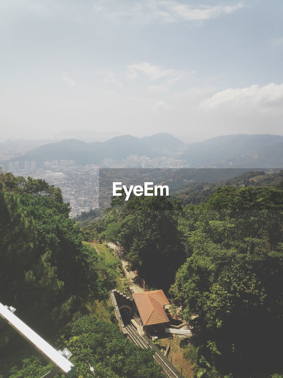 High angle view of trees and buildings against sky