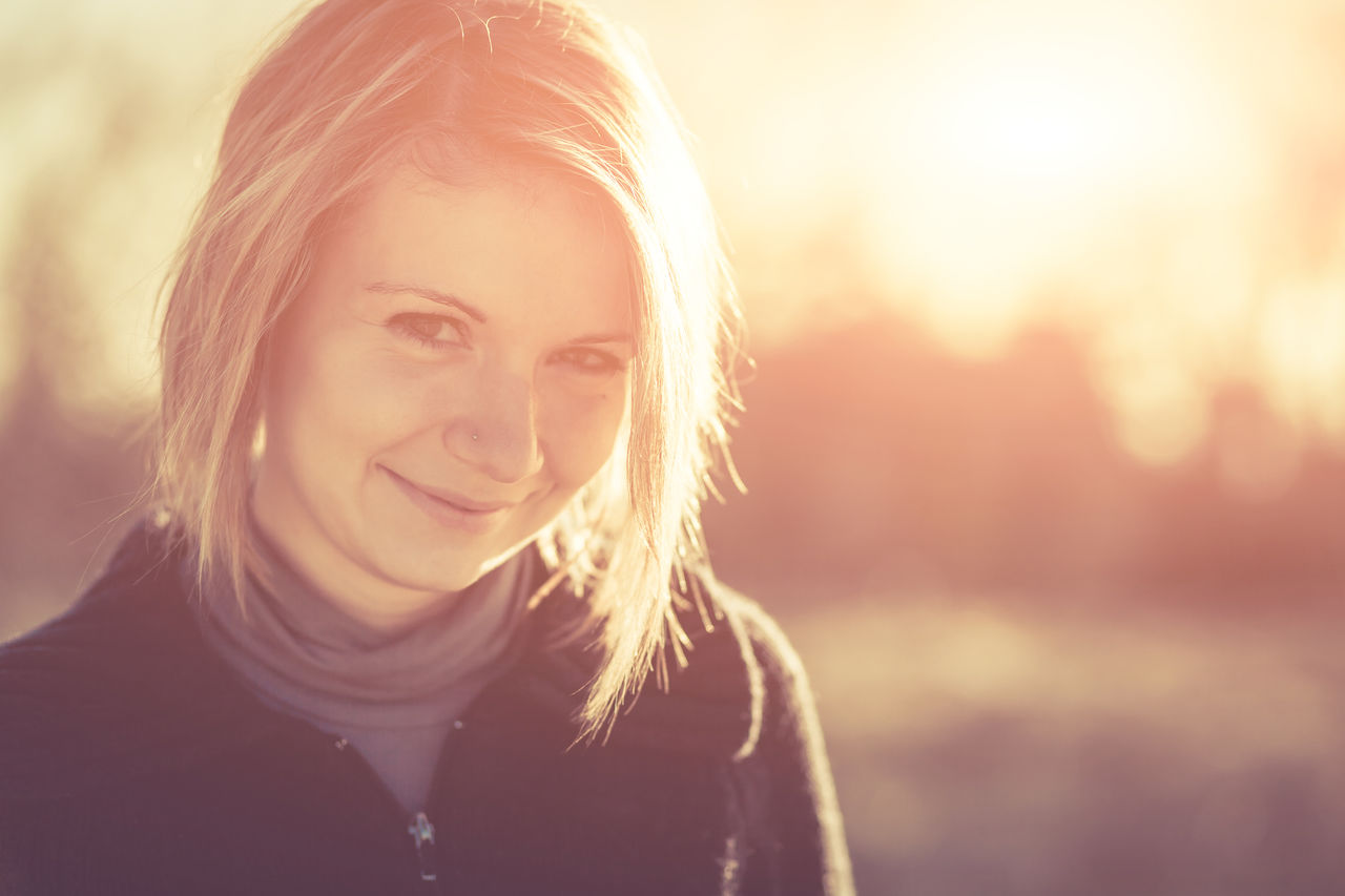 Close-up up portrait of smiling young woman