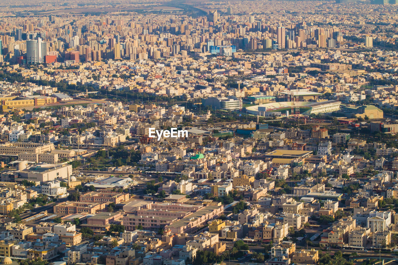 High angle shot of townscape against cityscape