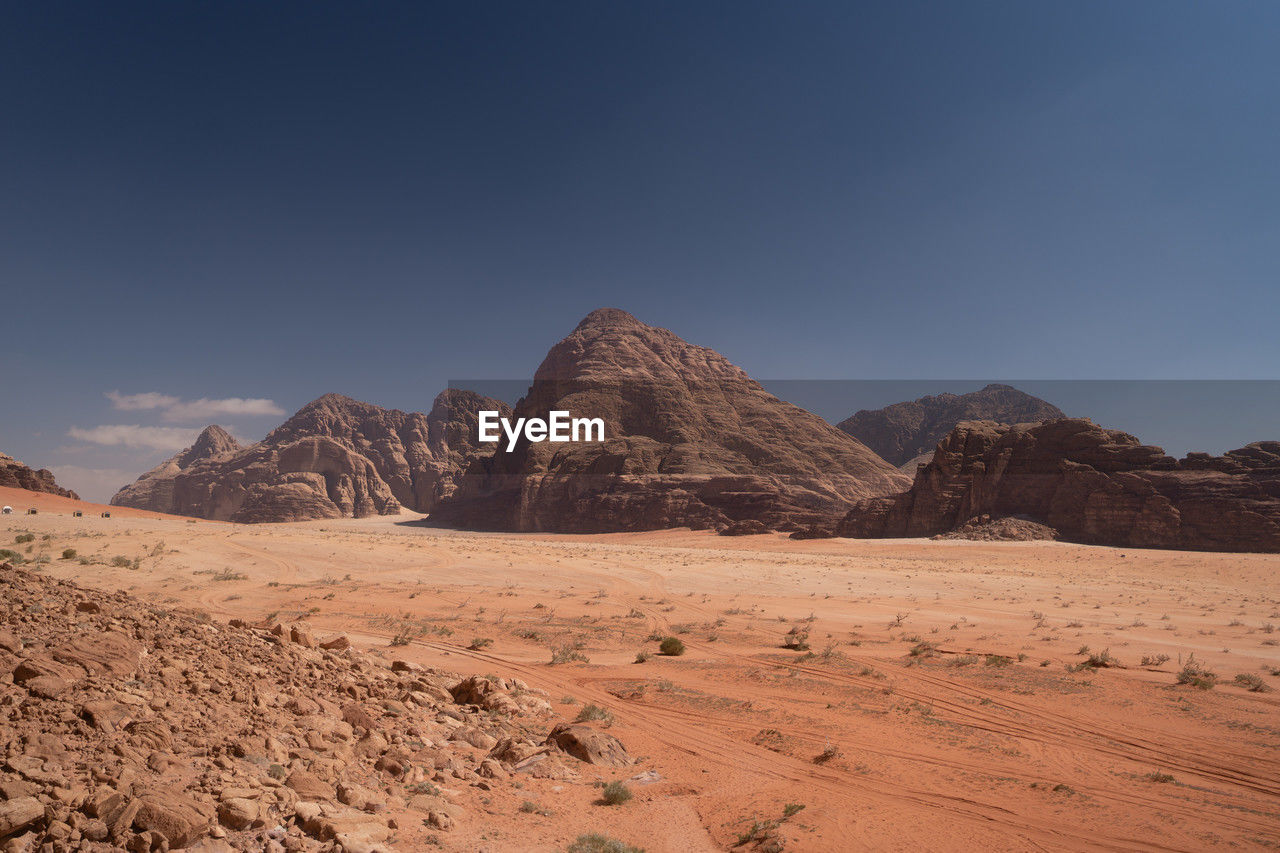 Scenic view of wadi rum against clear blue sky