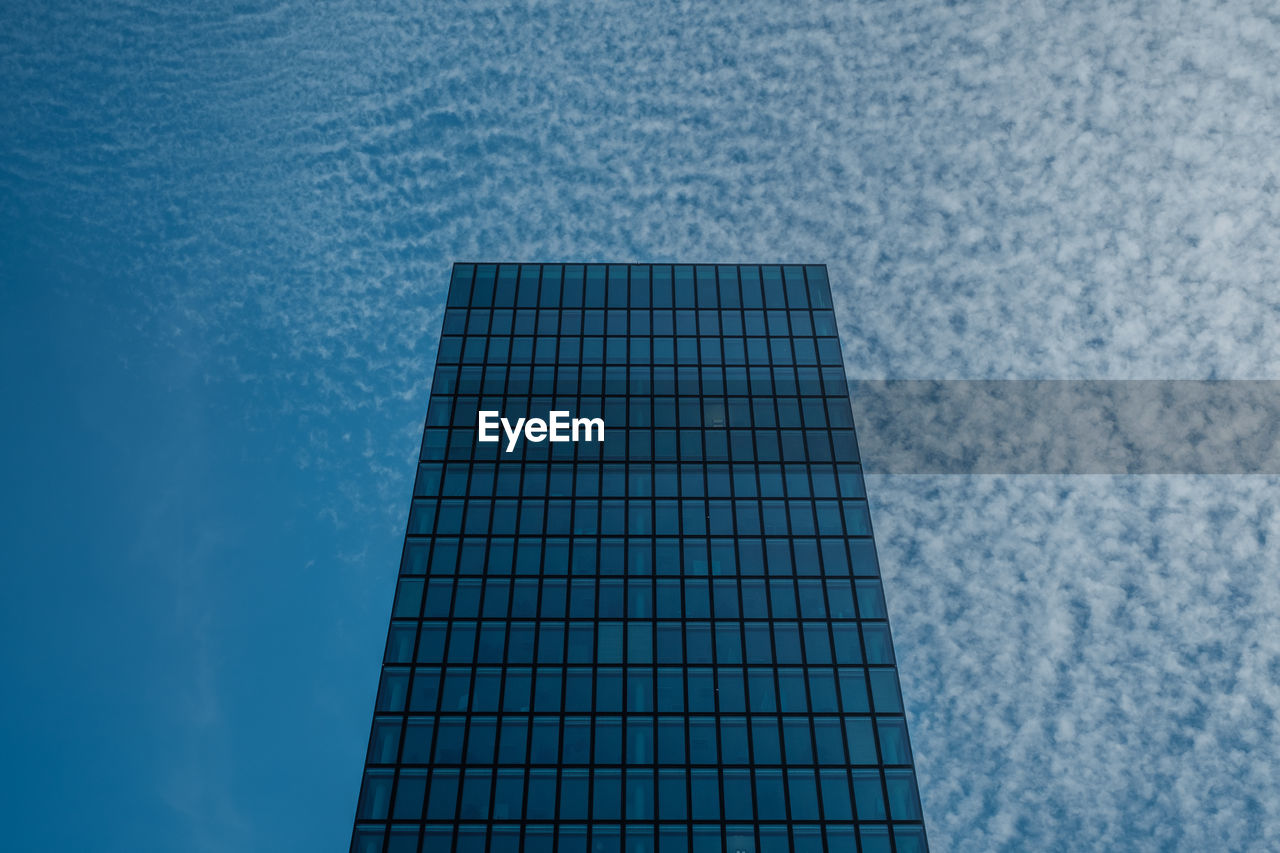 Close-up of building against blue sky