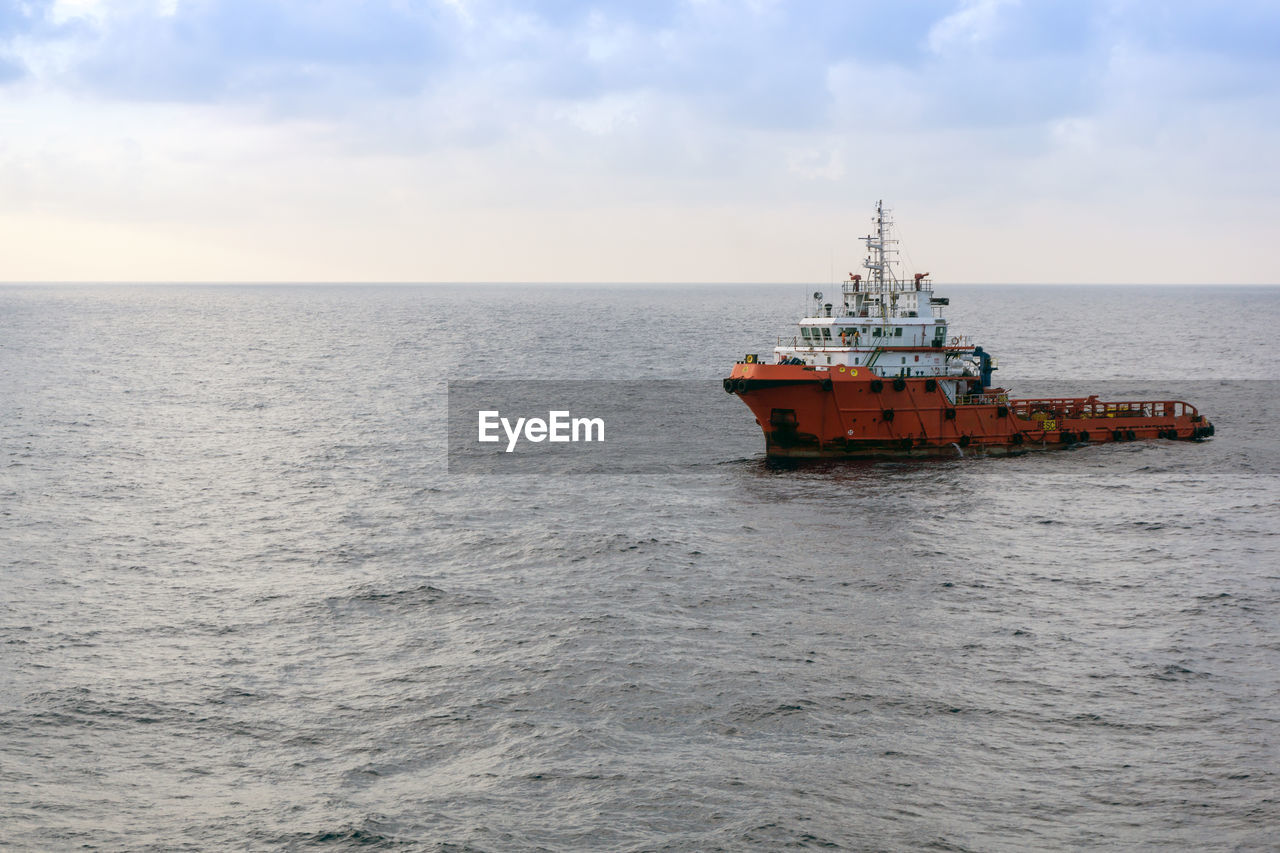 Ship in sea against sky