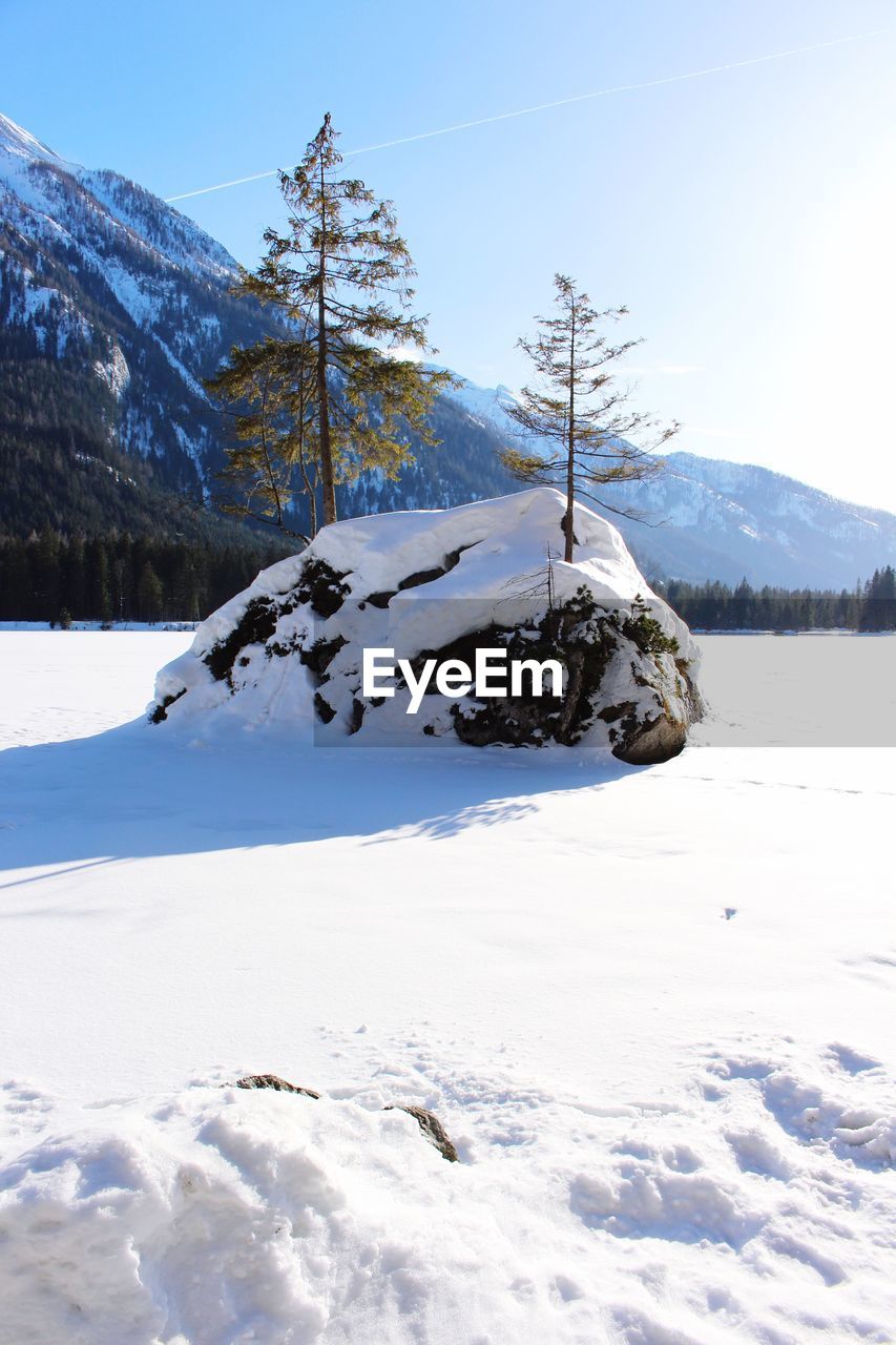 Scenic view of snow covered mountain against sky