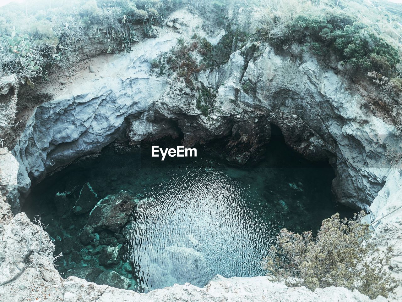 High angle view of rock formation in sea