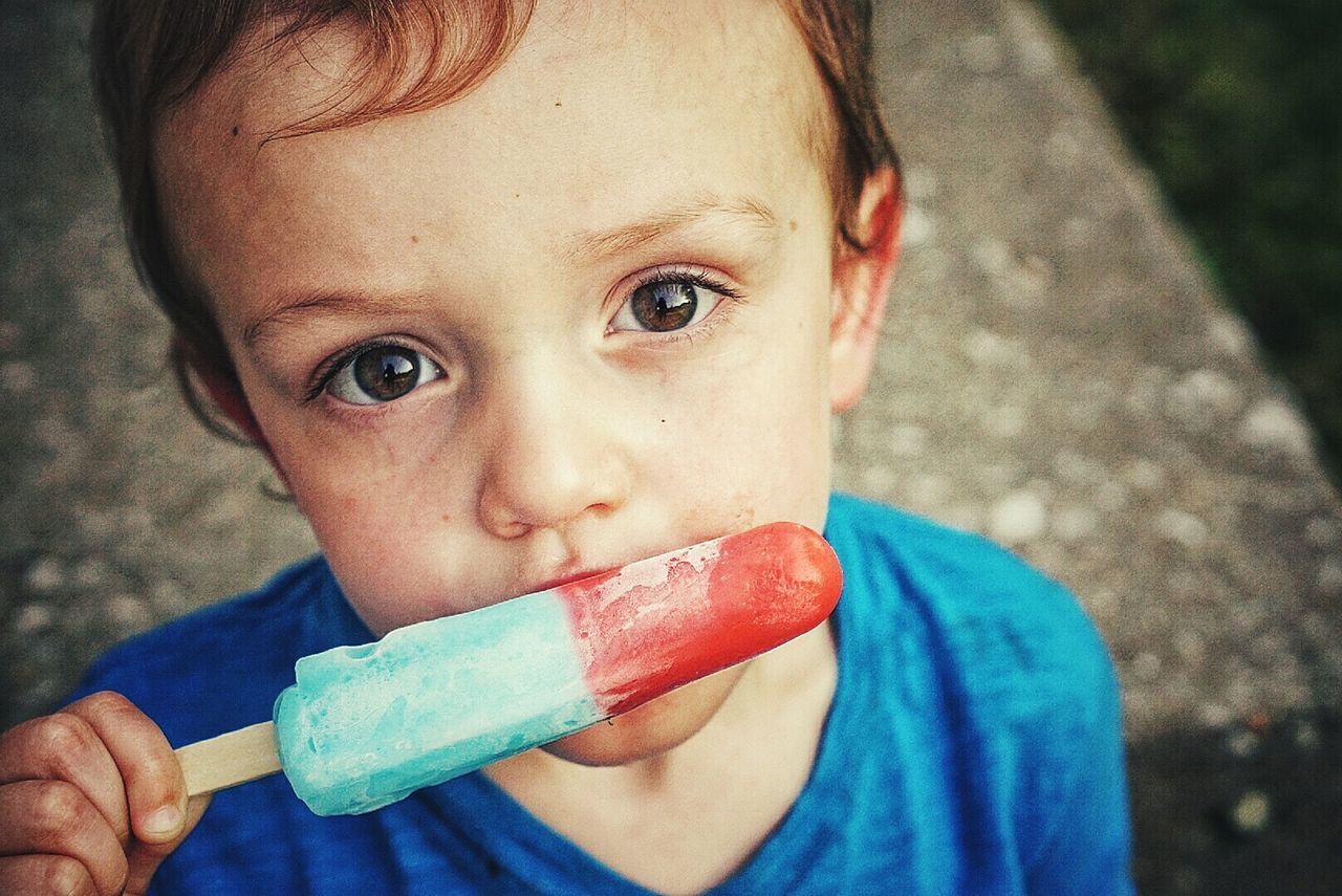 High angle portrait of boy eating ice cream