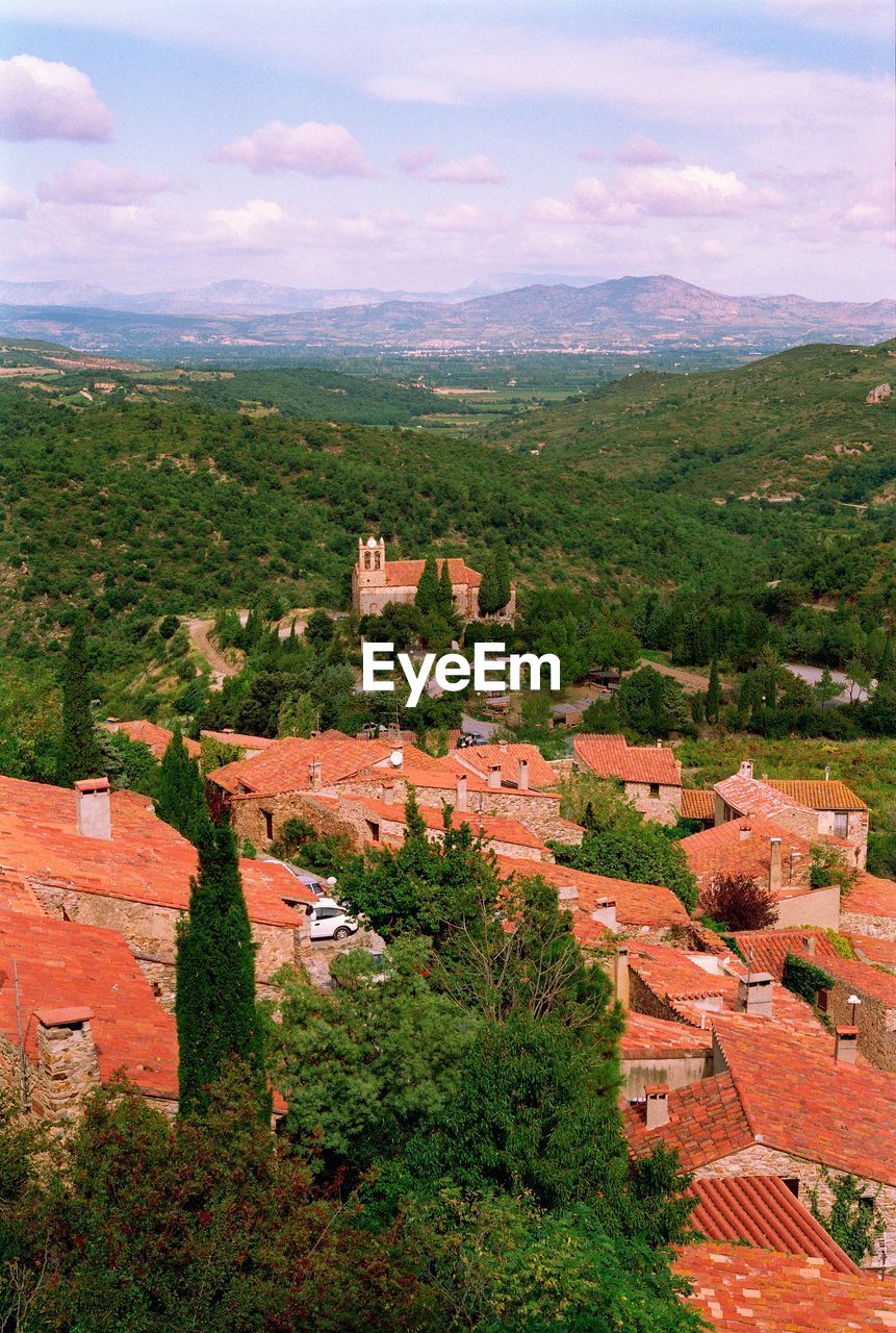 High angle view of trees and buildings against sky