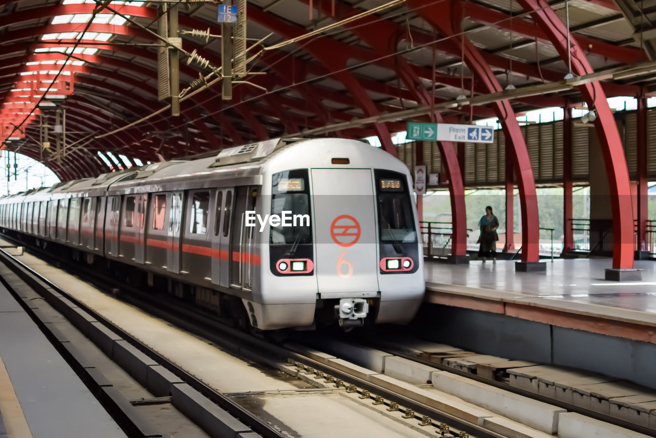 Delhi metro train arriving at jhandewalan metro station in new delhi, india,asia, public metro train