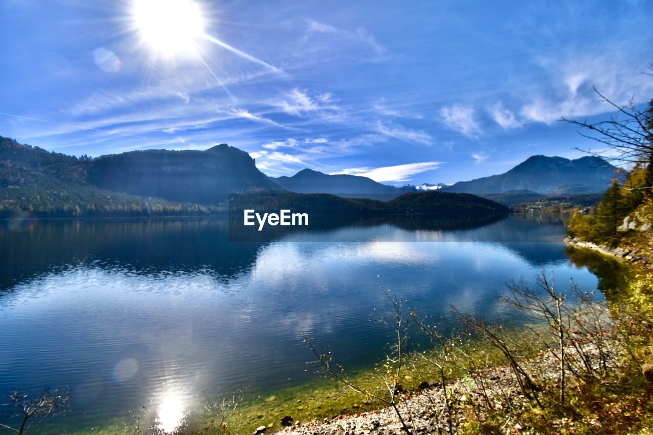 scenic view of lake against sky during sunset