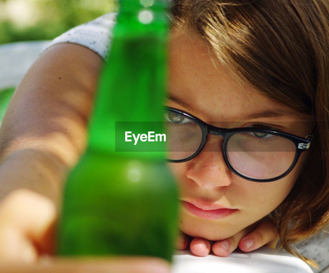 Close-up of girl holding bottle