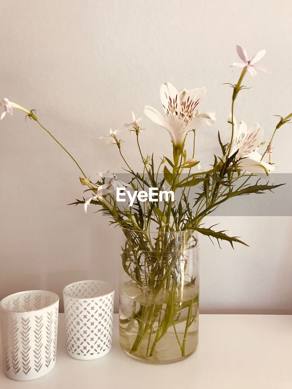 Close-up of white flower vase on table