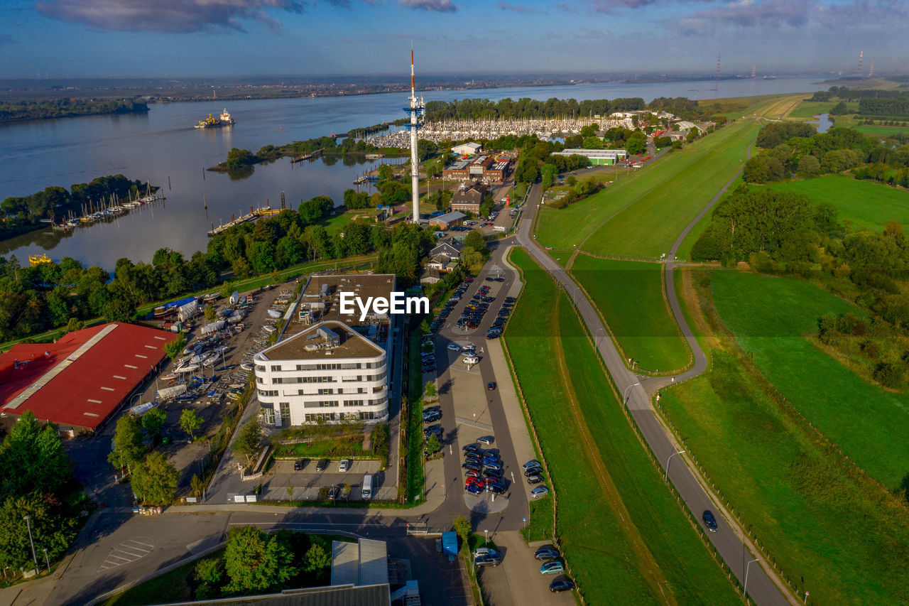 High angle view of trees and buildings in city