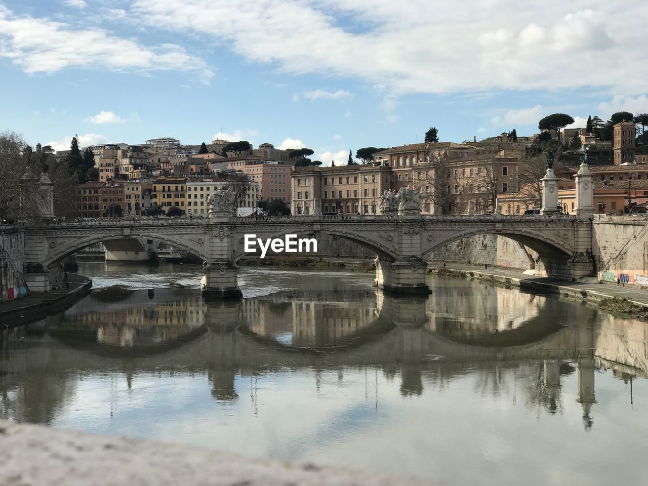 Ponte sant angelo bridge over tiber river against buildings and sky