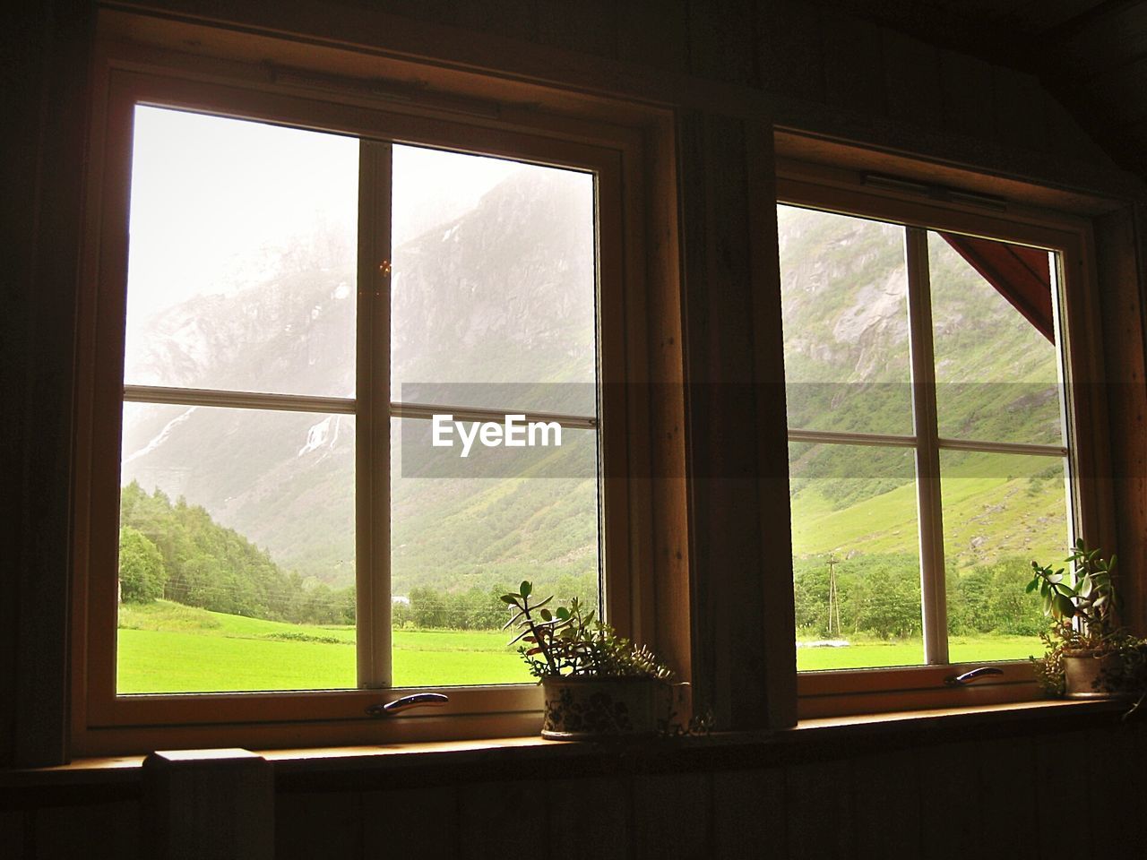 Green mountain landscape seen from house window