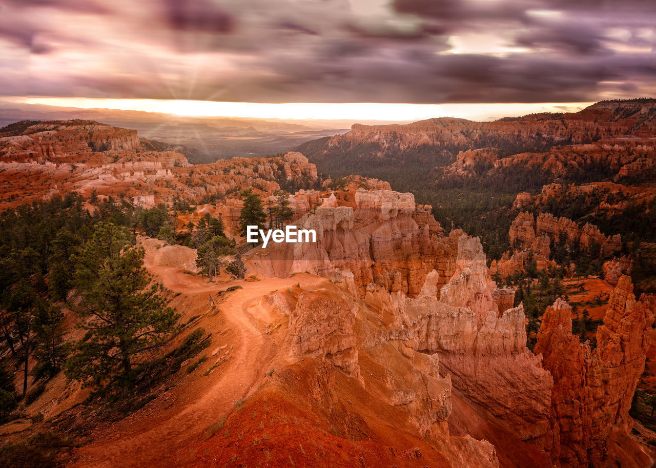 The first sun rays hit the hoodoos at the bryce canyon, utah