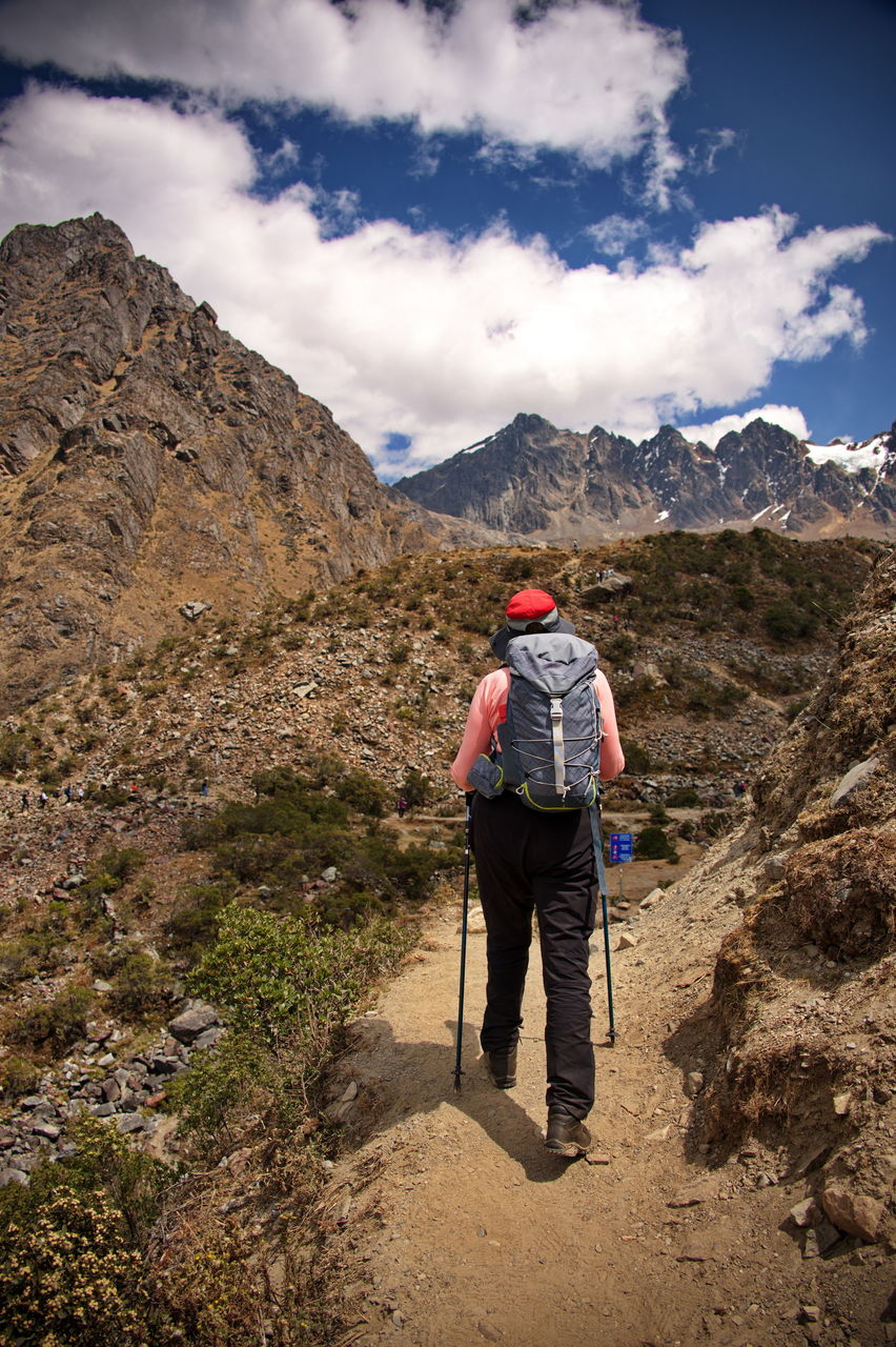 Rear view of senior woman hiking towards humantay lake in peru