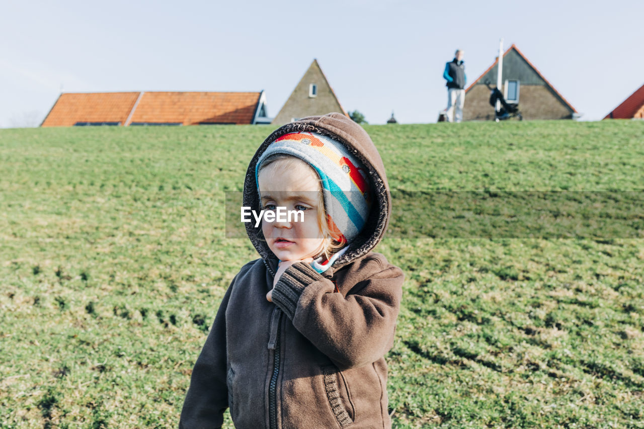 PORTRAIT OF BOY ON LAND