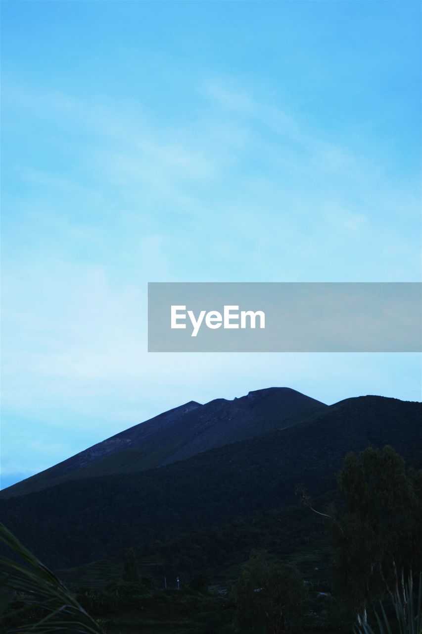 SCENIC VIEW OF MOUNTAINS AGAINST CLEAR SKY