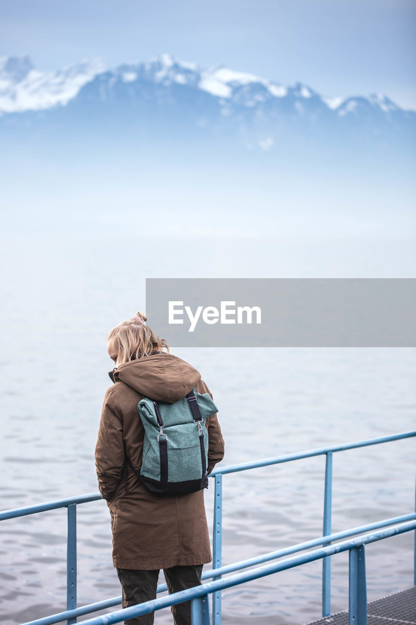 WOMAN LOOKING AT SEA