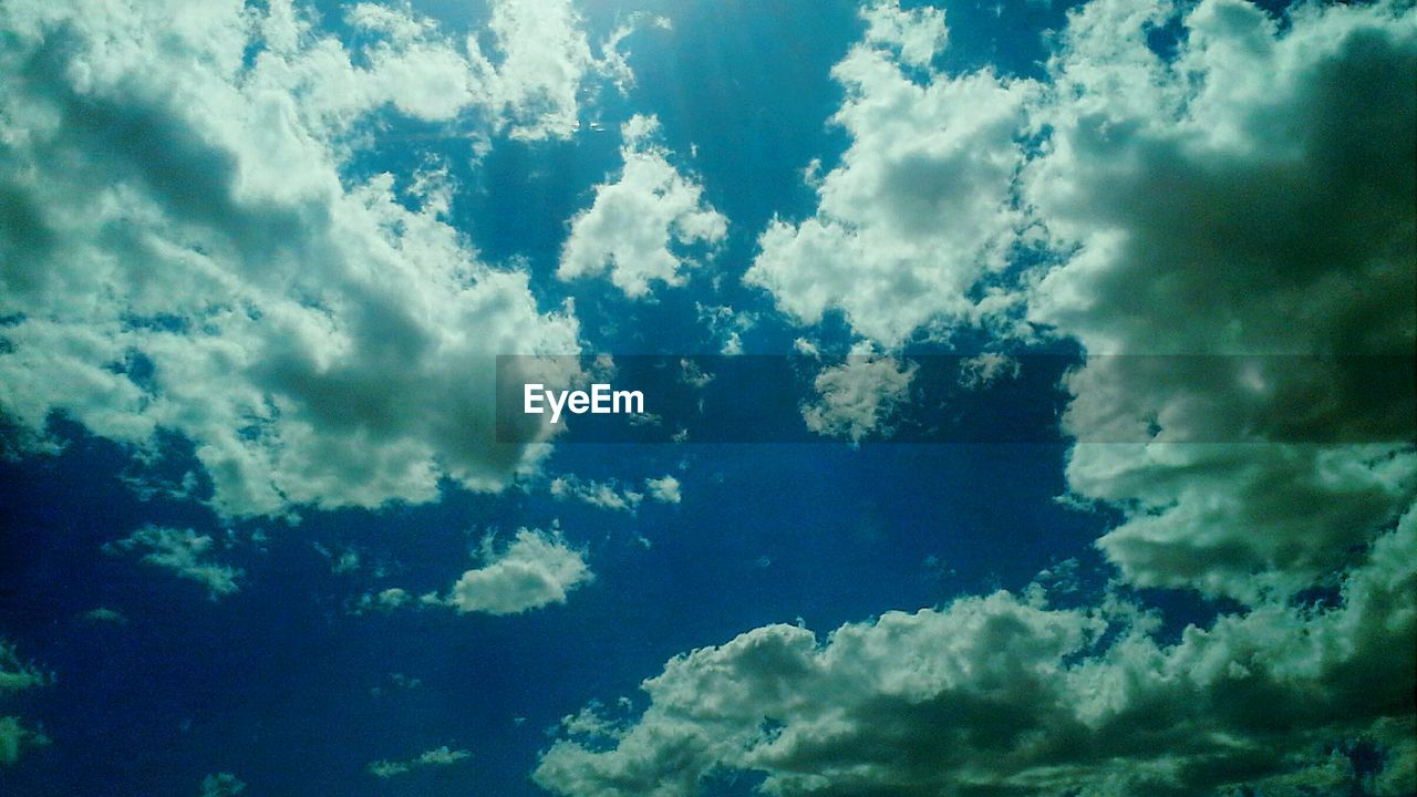 Low angle view of blue sky and clouds