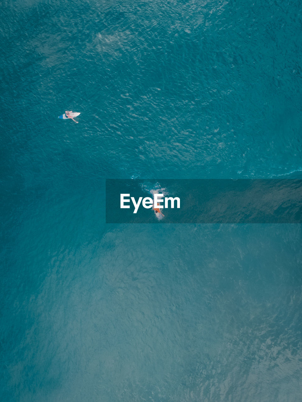 Aerial view of people swimming in sea