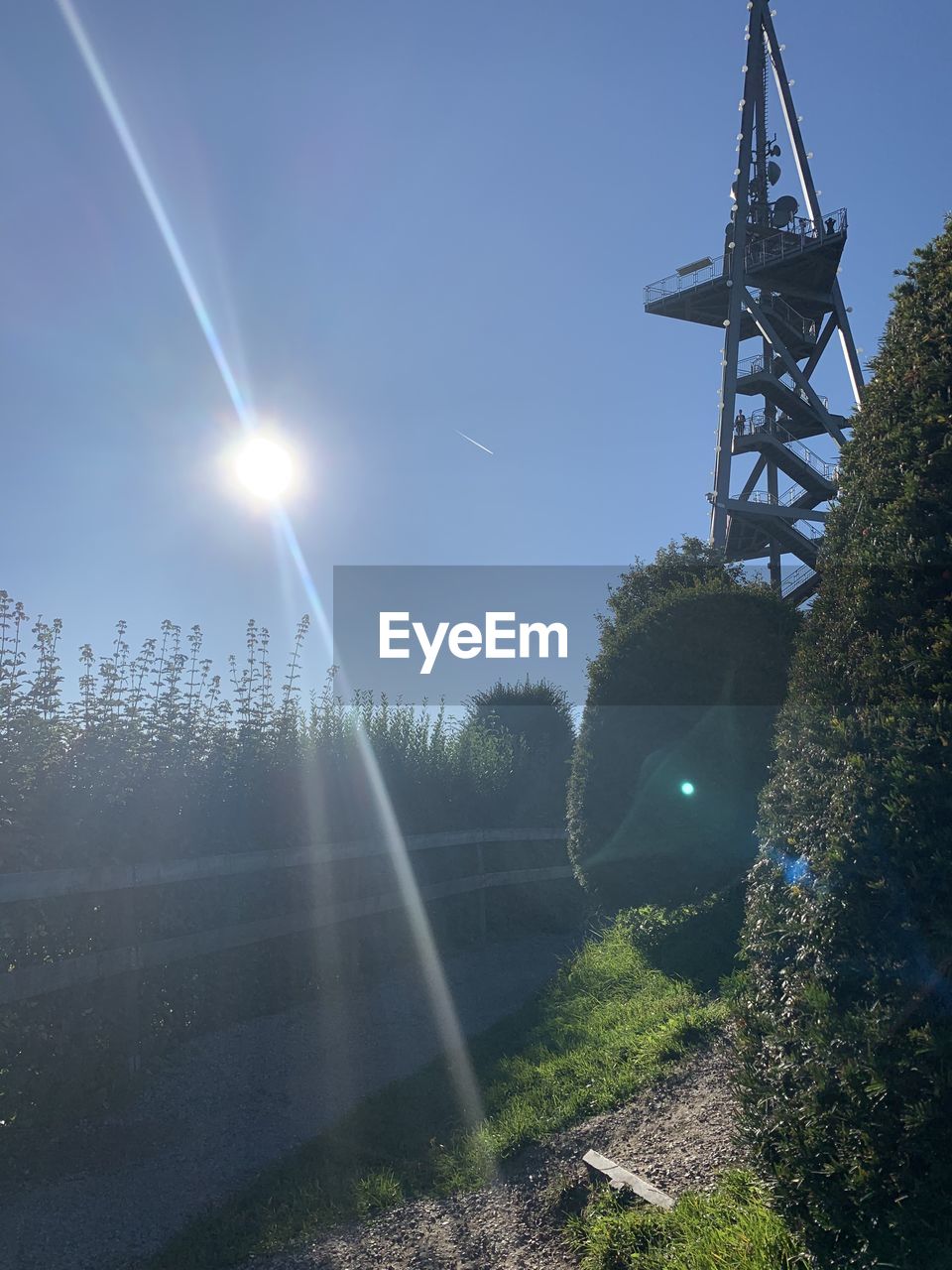 Scenic view of field against sky on sunny day