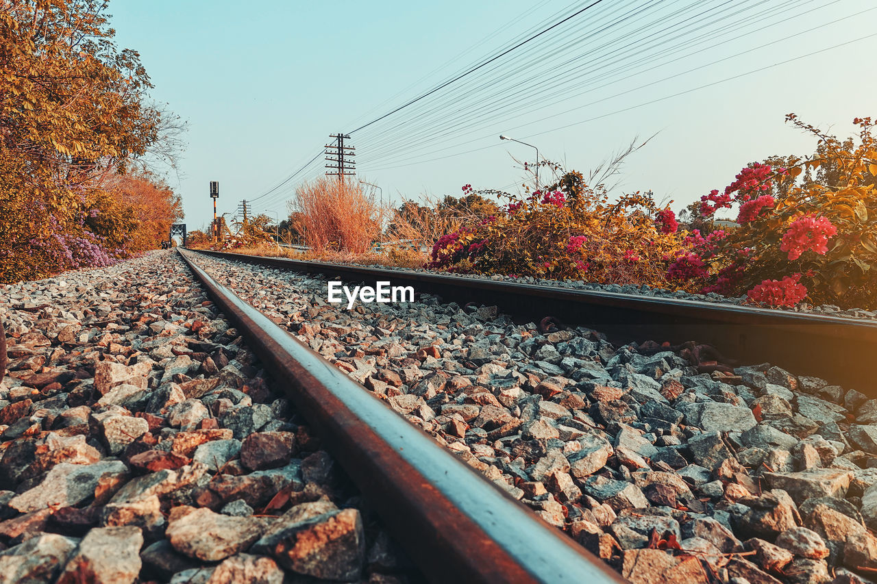 Surface level of railroad track against sky