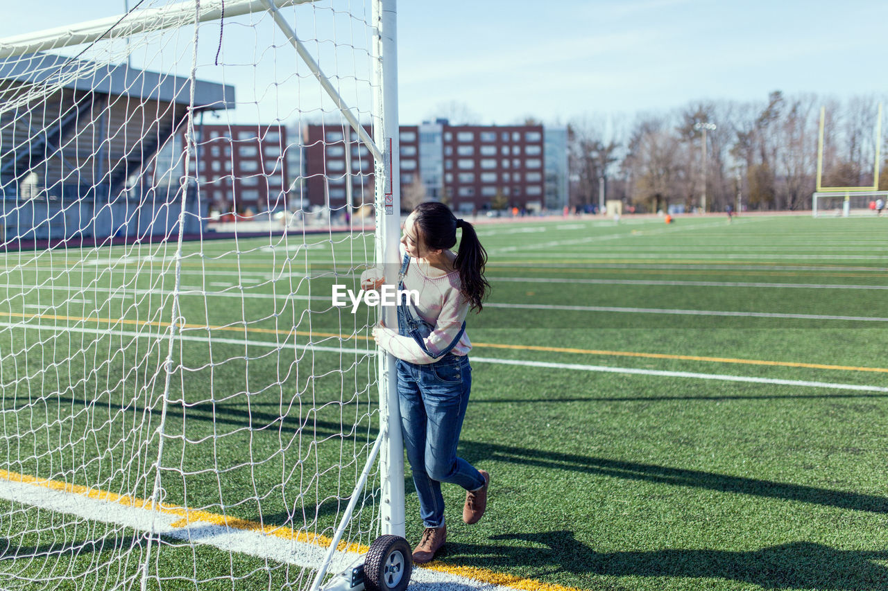 Woman with soccer goal