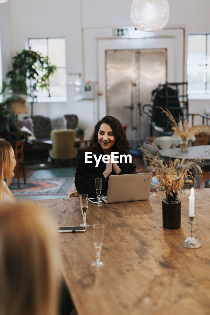 Female coworkers having meeting in cafe