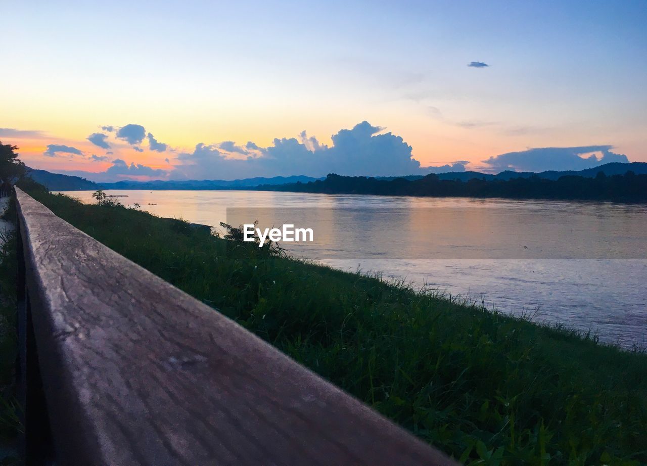 SCENIC VIEW OF SUNSET OVER LAKE
