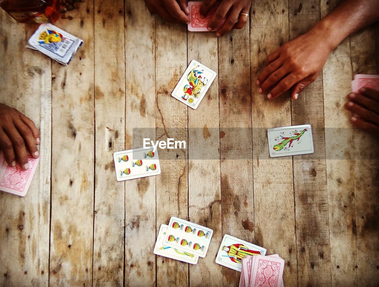 People playing cards on table